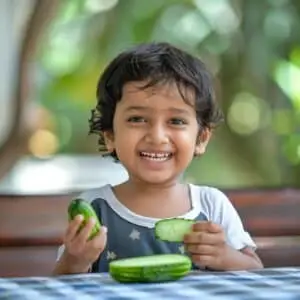 A girl is eating Cucumber - Healthy tips for summer