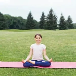 A girl is doing yoga- Healthy Tips for Summer